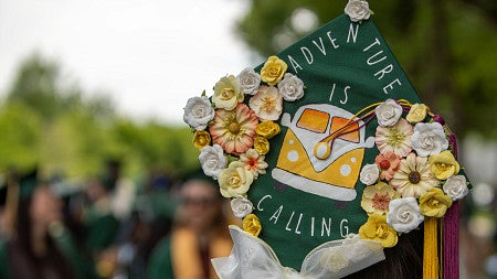 graduate with decorated cap