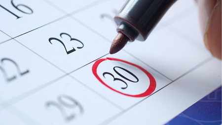 Red marker circling a date on a calendar.