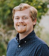 Nate Travis has strawberry blonde hair and goatee
