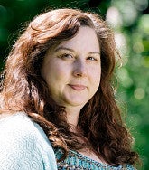 Jacy Bartlett has long brown hair.