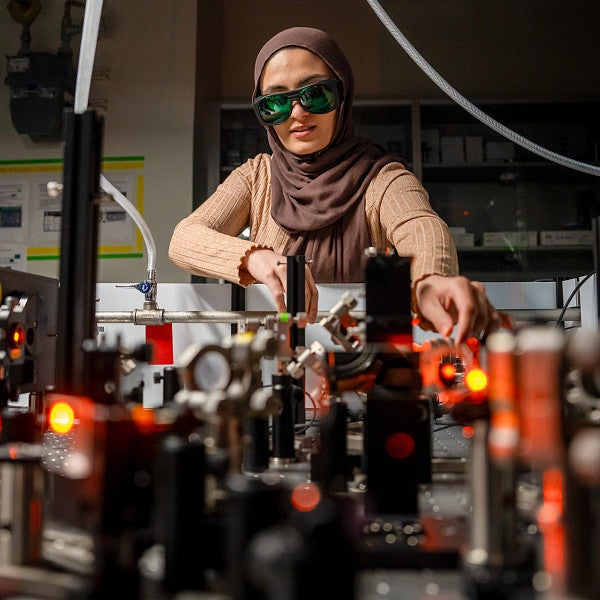 student working in the laser lab