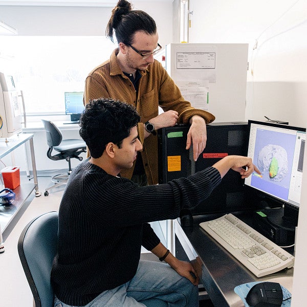 Student being mentored in a lab